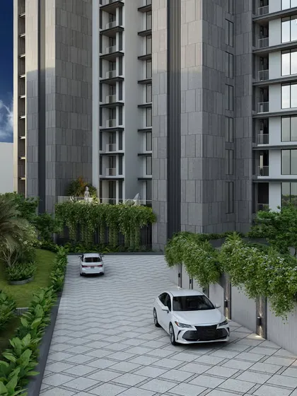 This luxury residential project in Bandra boasts large apartments with meticulously planned layouts. The design features a linear facade with sublime lines that gracefully soften the building's large scale, surrounded by ample green landscapes.