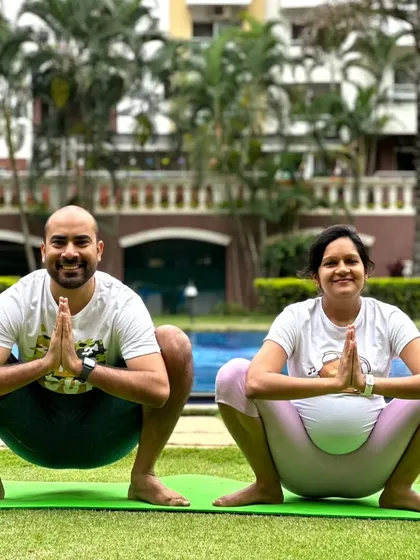 We proudly offer specialized prenatal yoga for expecting mothers. Here, a couple practices Malasana (Garland Pose) together, a wonderful way to prepare the body for childbirth and connect with each other during this special time.