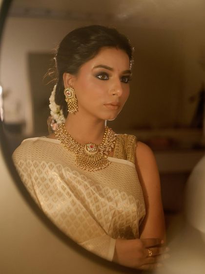 A reflection shot that adds a layer of depth and artistry to the portrait.