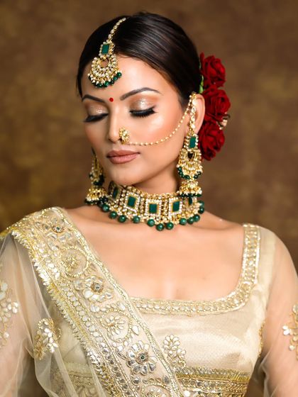A subtle and glowing look for the bridal season. This features neutral shimmery eyes and a soft nude lip.