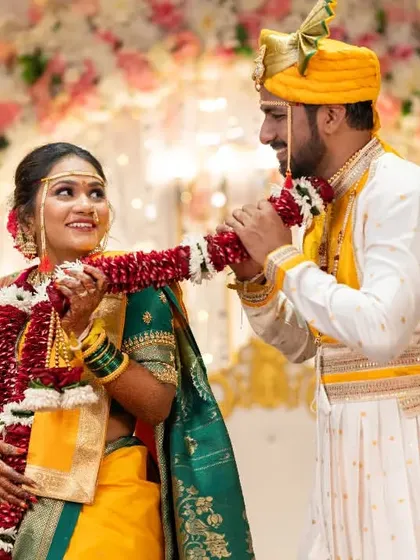 The Varmala or garland exchange ceremony, a playful and significant part of the wedding that we capture from the best angles.