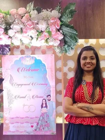 Posing next to the welcome sign for the engagement of Ramil and Avani.