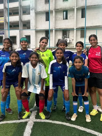 The victorious U17 girls team posing with their coach after winning the Girls Youth Football Championship. A proud moment for the entire squad and the academy.