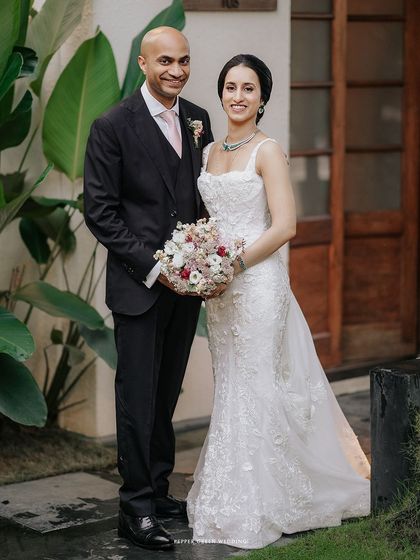 A classic portrait of the elegant bride and groom, ready to celebrate their union. Their poised and happy expressions tell a story of love and commitment.