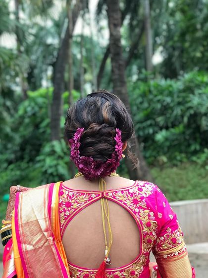 The full back view of this gorgeous Maharashtrian bridal bun, a true work of art.
