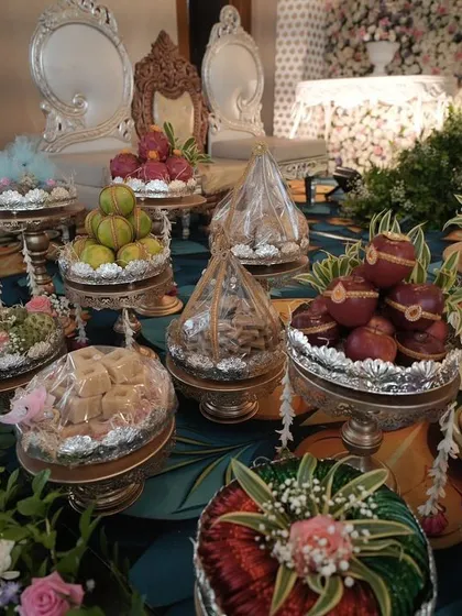 A close-up of the beautifully arranged and decorated sweets and gifts for a traditional ceremony. Attention to detail is key to making these displays special.