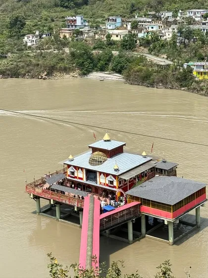 A view of a temple on the banks of the river during our Kedarnath Tunganath trip. The journey is filled with such serene and spiritual sights.