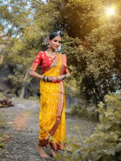 An outdoor portrait of a model in a traditional yellow Maharashtrian saree. I use the natural environment and sunlight to create a vibrant, authentic image that celebrates cultural beauty.