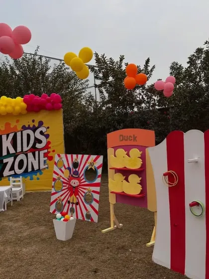 We can create a dedicated "Kids Zone" with age-appropriate carnival games. This area featured a ring toss, a duck matching game, and a ball toss, all designed with bright, welcoming colors.