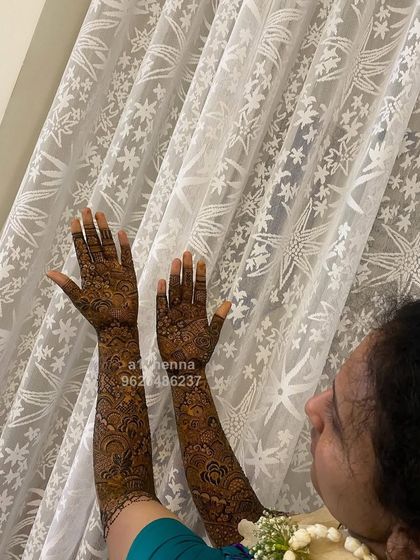 Another perspective of the full-sleeve bridal henna, highlighting the consistency and detail of the artwork.