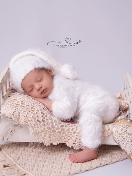 Sometimes, the simplest pictures are the most beautiful. This all-white setup with a tiny bed is pure, clean, and timeless, focusing solely on the baby's peaceful slumber.