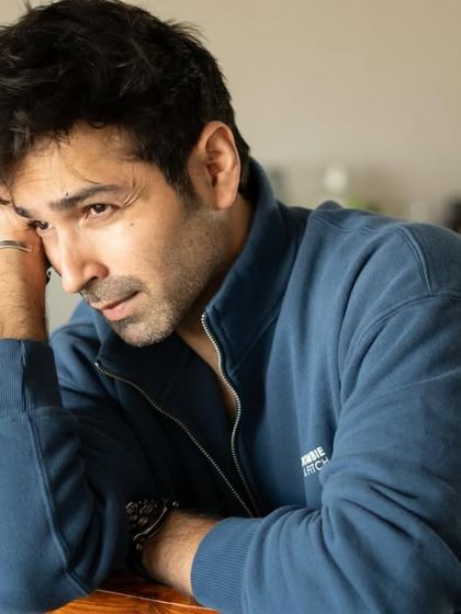 A pensive moment from the same session with Varun Mitra. The natural light and simple setting keep the focus entirely on his expression.
