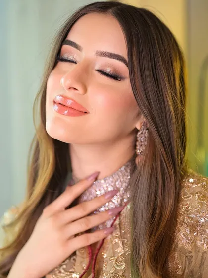 A moment of pure bliss. This shot captures the soft, shimmering eyeshadow and glossy lips that are part of my signature soft traditional makeup look.