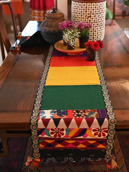 A different view of the Soof embroidery-trimmed runner, highlighting the geometric patterns and vibrant colors of the patchwork.