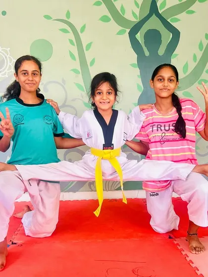 Our students love to show off their flexibility. This fun pose is a result of consistent and dedicated stretching.