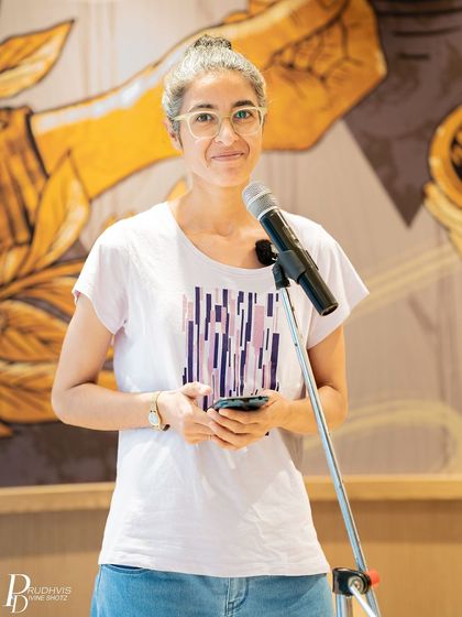 A smiling performer at the "Voices of the Nation" meetup. The event was a beautiful showcase of diverse perspectives on the nation.