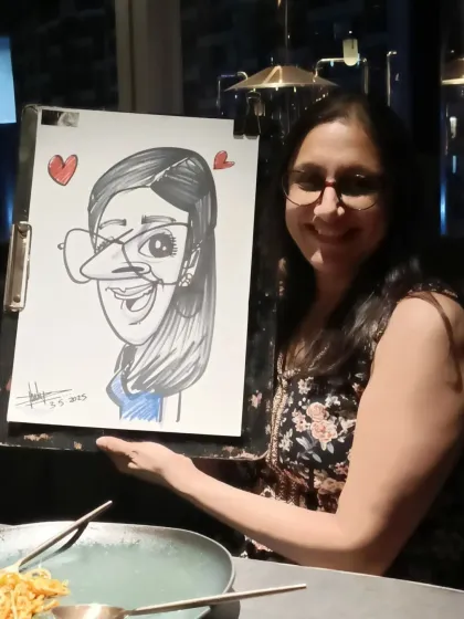 A guest at Nincasa, a fine dining restaurant and brewhouse in Magarpatta. Come for the beer and food, and get a caricature on the weekends.