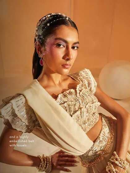 A closer look at the Jenna Saree Set, highlighting the embellished belt with tassels and the intricate embroidery on the modern, structured blouse.