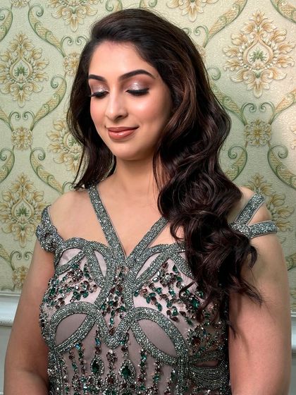 A close-up of the shimmery eye makeup. The neutral tones with a hint of sparkle add a touch of glamour without being overpowering.