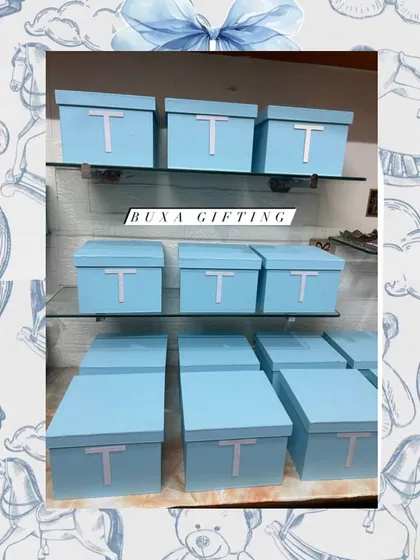 For a truly luxurious celebration, I designed these Baby Dior themed centerpiece boxes in a classic powder blue with a custom initial.