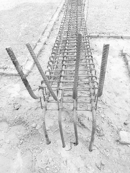 A close-up of the rebar framework for a structural column. This is the essential skeleton that provides strength and form to the concrete structure.