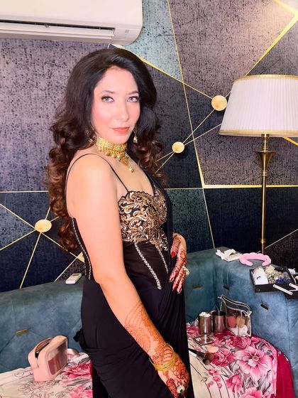 Another angle of this stunning party look, showcasing the beautiful details of the outfit and the flawless makeup.