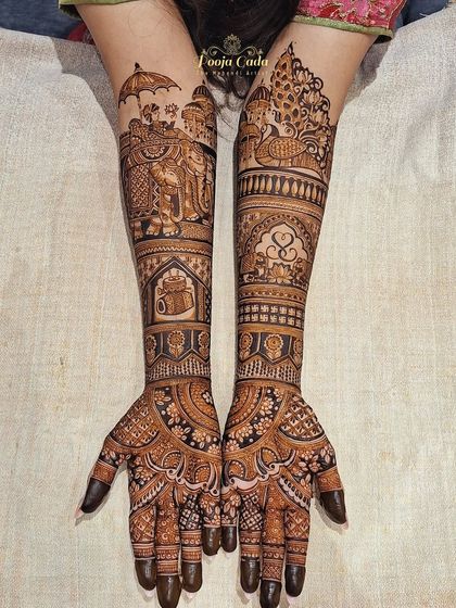 A closer look at the hands from the previous set, showcasing a royal baraat scene on one arm and a beautiful peacock on the other.