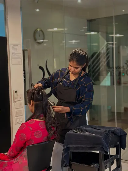 From mannequins to real clients, our students transition smoothly. Here, a student practices her styling techniques on a live model in the salon.