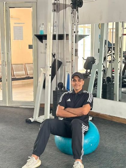 A relaxed pose on the stability ball.