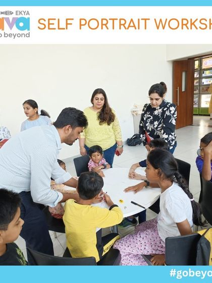 An instructor offers guidance and encouragement to a table of young artists during the Self-Portrait Workshop. My approach is nurturing and hands-on, ensuring every child feels supported in their creative journey.