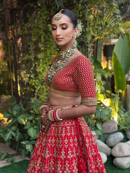 An outdoor shot of a bride with a classic floral updo.