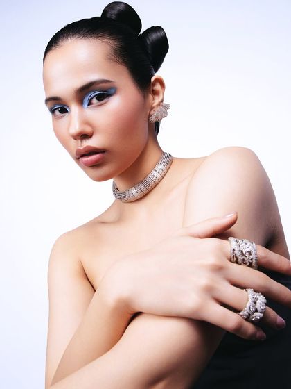 A slightly different angle that brings the hands and rings into sharper focus. This composition is perfect for showcasing a full set of jewelry.