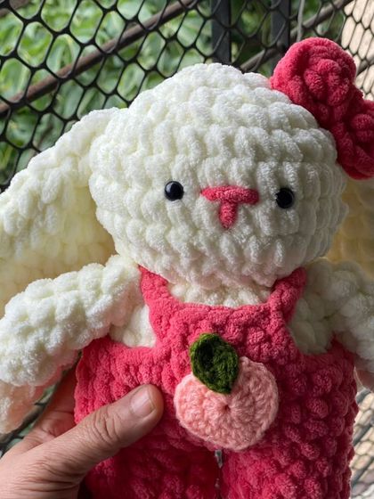 My Pookie Bunny is ready for her close-up. The plush yarn I use makes her incredibly soft to the touch, perfect for a comforting cuddle buddy.