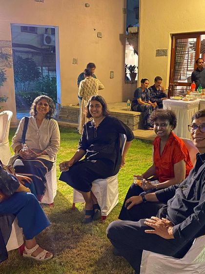 Guests enjoying the evening at the dinner party.