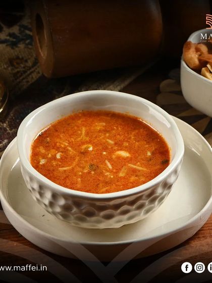Harira soup, a traditional Moroccan comfort food. This hearty soup is made with tomatoes, lentils, chickpeas, and spices, offering a warm and flavorful start to any meal.