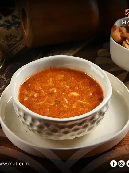 Harira soup, a traditional Moroccan comfort food. This hearty soup is made with tomatoes, lentils, chickpeas, and spices, offering a warm and flavorful start to any meal.