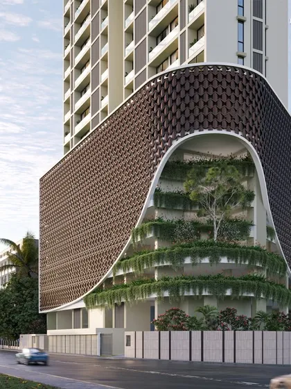 We imagined this Malabar Hill residence as an 'Urban Forest'. The design features a symphony of cascading greenery juxtaposed with abstract architectural forms, like the fluid metal cladding on the podium, creating a serene escape from the urban rush.
