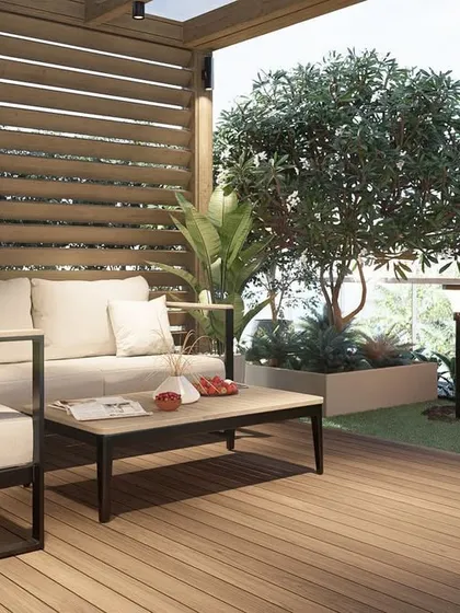 This render highlights the proposed materials, such as the wooden decking and slatted privacy screen, as well as the placement of mature trees in large planters for the Khar terrace.