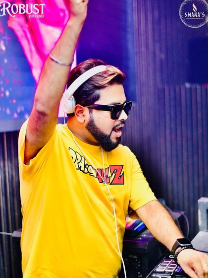 Every beat tells a story. A high-energy action shot of me with my hand in the air, getting the crowd hyped up.