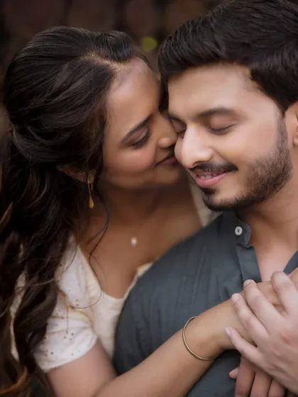 A close-up shot capturing the warmth and affection between the couple during their outdoor pre-wedding shoot. The soft, natural lighting highlights their genuine connection, which is what I always aim to achieve through my creative direction.