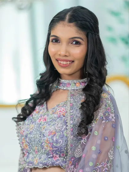 A close-up of a soft glam makeover. Notice the subtle contouring, the perfectly blended eyeshadow, and the natural-looking lip color that come together for a polished and camera-ready finish.