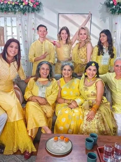 A happy group shot from the Matrimonials India ad shoot we styled. We outfitted the entire cast in coordinated yellow outfits for this Haldi ceremony scene, showing we can handle large-scale production needs.