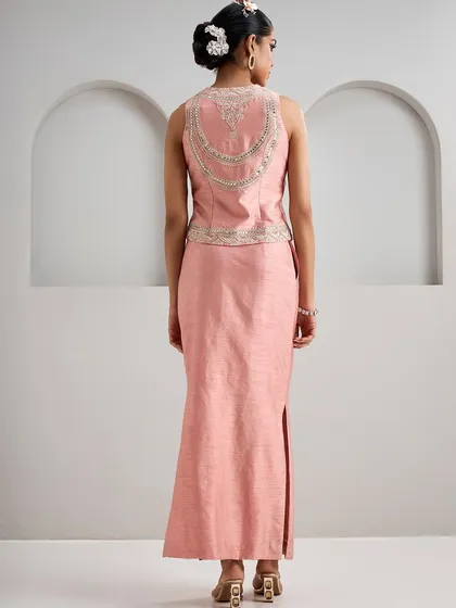 The back of this pink vest features a surprising and elegant detail, with draped embroidery that resembles a piece of jewellery. It’s these thoughtful touches that define my curation.