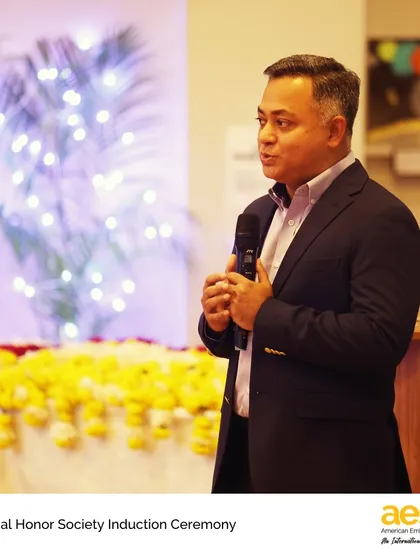 Our High School Principal, Mr. Syed, addresses the students and families at the National Honor Society Induction Ceremony, speaking on the importance of leadership and character.