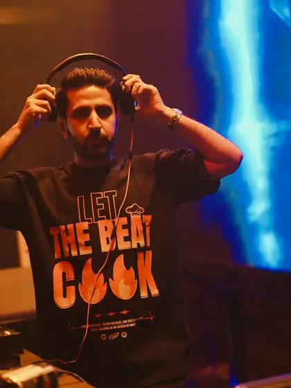 In the zone, focused on the mix at a show in Hyderabad. This shot captures the concentration it takes to blend tracks and "let the beat cook," crafting the perfect sound for the crowd in front of me.
