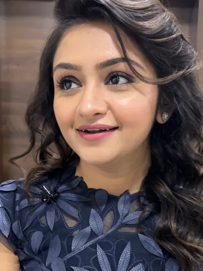 A candid shot showing off the beautiful soft glam makeup. It's elegant, sophisticated, and perfect for a cocktail party guest.