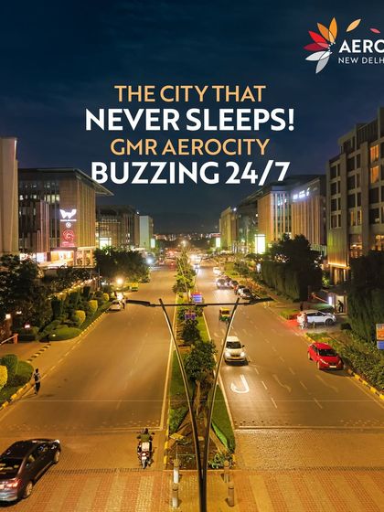 The city that never sleeps. This stunning nighttime shot of the main boulevard at Aerocity, with its bright lights and bustling traffic, showcases the 24/7 energy of the destination.