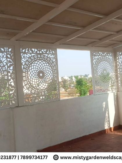 The view from inside the terrace, looking out through the CNC panels. They provide privacy from the outside while still allowing a view and letting in natural light.