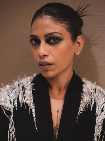 A close-up portrait of Anasuya Sengupta with a bold, smoky eye. This shot is all about drama, confidence, and high-fashion beauty.