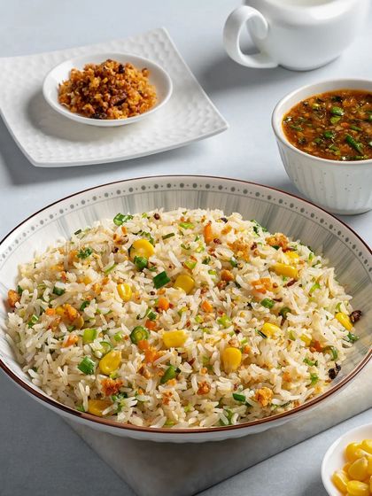 A bowl of corn and egg fried rice, a simple and classic Asian comfort food.